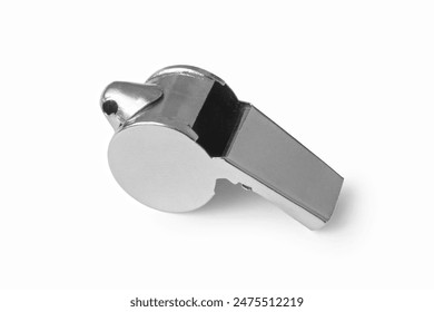 A simple metal whistle isolated on a white background. Whistle close-up.