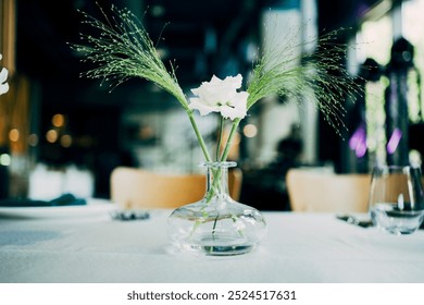 Simple minimalistic floral arrangement in glass vase.  - Powered by Shutterstock