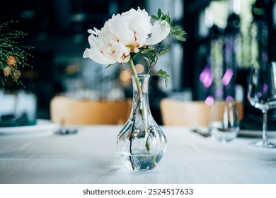 Simple minimalistic floral arrangement in glass vase.  - Powered by Shutterstock