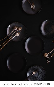 Simple Modern Kitchen Still Life In Black Ceramic Plate Bowls Against A Black Brick Wal With Dry Garlic Dried Red Peppers Still Life 