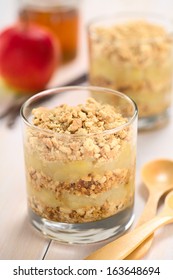 Simple No-bake Danish Apple Cake Called Aeblekage Made Of Stewed Apple And Vanilla Cookie Crumbs Served In Glass (Selective Focus, Focus One Third Into The Cookies On The Top)