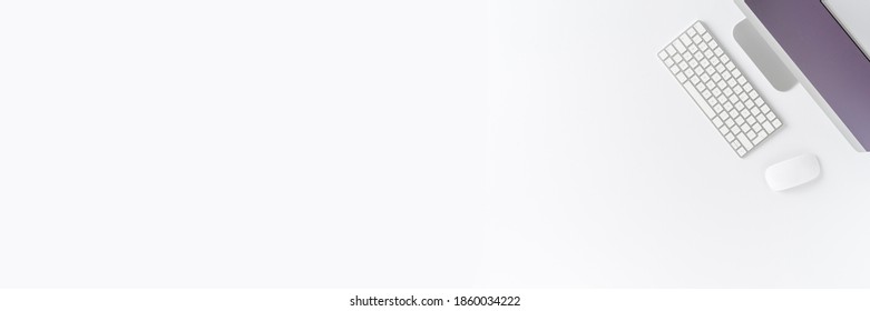 Simple office desktop with computer on white background with copyspace. Top view. Banner