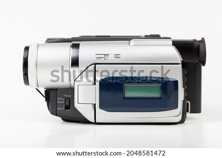 Simple old consumer grade retro camcorder, cassette tape video camera recorder, object closeup, isolated on white, cut out. Obsolete old technology, filmmaking, movie making equipment concept, nobody