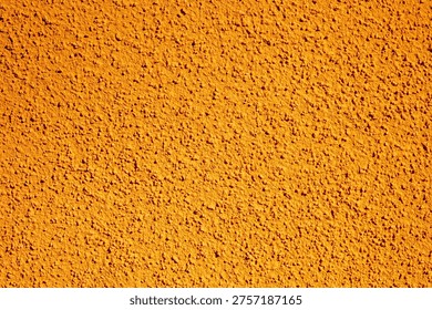 Simple orange plaster texture background; grain noise rough surface with relief effect for design; abstract orange grunge wall pattern for art