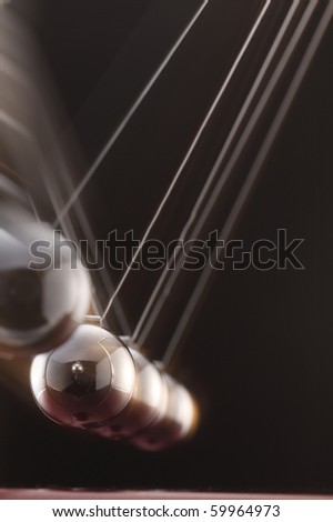 A simple pendulum swinging across.