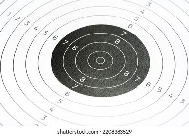 Simple plain circle shape round gun shooting paper target object closeup detail, nobody. Target practice shooting range accessories, aim training, accuracy concept, no people. Gun sports, competitions