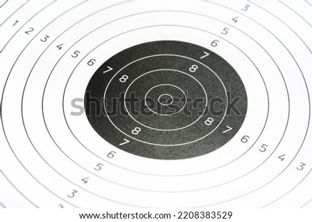 Simple plain circle shape round gun shooting paper target object closeup detail, nobody. Target practice shooting range accessories, aim training, accuracy concept, no people. Gun sports, competitions