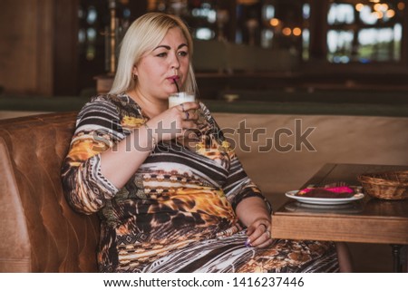 Simple plump woman at city. Lady in cafe rest and enjoying
