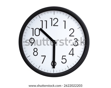 Simple round wall clock with black frame and white face, showing the time exactly at 10:30 or 22:30. Representing time precision in concepts of deadlines.