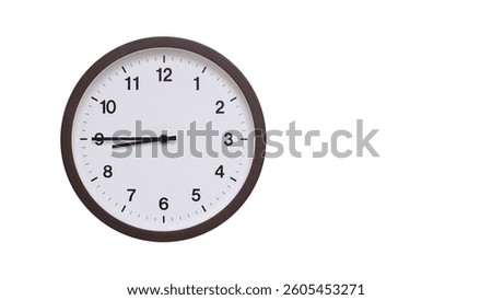 A simple round wall clock with a dark brown frame and a white face displaying 8.45, 20.45. Isolated on a white background, perfect for time-related concepts, deadlines, and schedule themes.