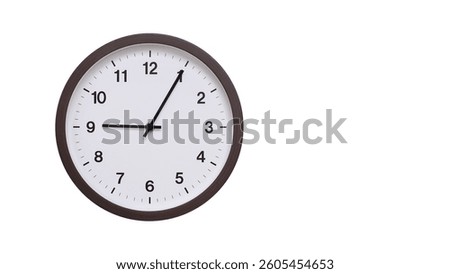 A simple round wall clock with a dark brown frame and a white face displaying 9.05, 21.05. Isolated on a white background, perfect for time-related concepts, deadlines, and schedule themes.