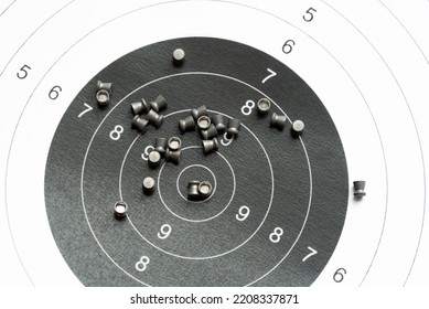 Simple Shooting Target And Lots Of Metal Pellets Laying On Top Of It, Object Closeup, Detail, Nobody. Airguns, Sport. Pellet Ammo, Air Gun Ammunition, Range Aim Training, Practice Concept, No People