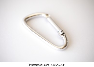 Simple silver caribiner on a white background 