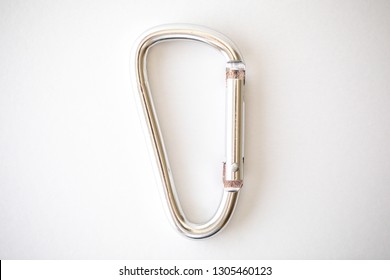 Simple silver caribiner on a white background 