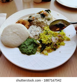 Simple South Indian Breakfast. Includes Idli, Vada, Poha And A Type Of Noodles With Two Varities Of Chutneys