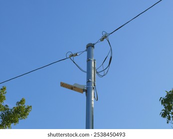 A simple street light that stands along the path in the sports park. - Powered by Shutterstock