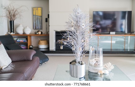 Simple Summer  Christmas Small White Tree On Glass Table With Seaside Vase Decoration In Lounge.