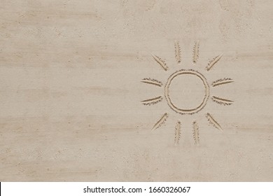 simple sun drawing in the sand the beach  room for your copy space 