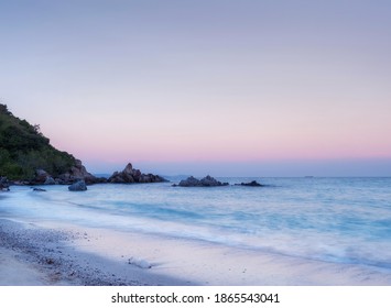 simple sunrise with shell on the beach a symbolic nature art design and natural decoration with long exposure