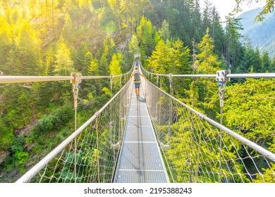 Simple Suspension Footbridge Over Mountain Valley