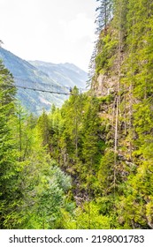 Simple Suspension Footbridge Over Mountain Valley