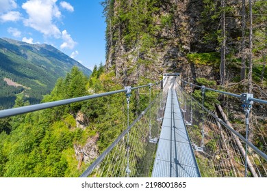 Simple Suspension Footbridge Over Mountain Valley