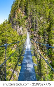 Simple Suspension Footbridge Over Mountain Valley