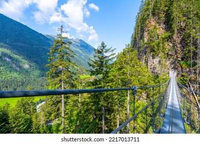 Simple Suspension Footbridge Over Mountain Valley