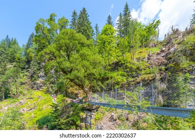 Simple Suspension Footbridge Over Mountain Valley