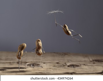 Simple Things - Peanut Man Flying with Dandelion Blowball Umbrella - Powered by Shutterstock