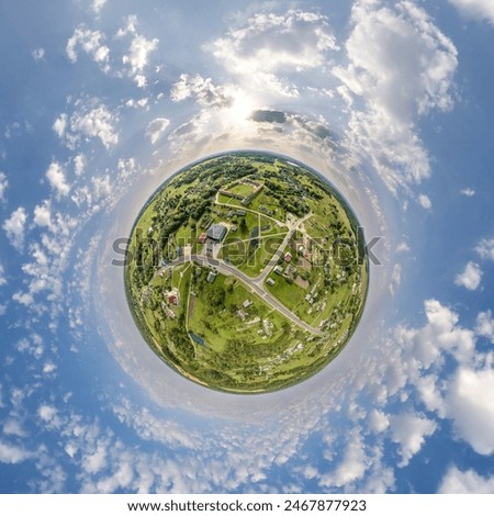 simple tiny planet without buildings in blue sky with beautiful clouds. Transformation of spherical panorama 360 degrees. Spherical abstract aerial view. Curvature of space.