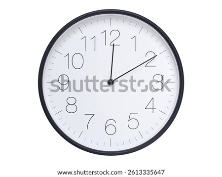 Simple wall clock with black frame and white face displaying 00:10 or 12:10. Ideal for time, schedule, and punctuality themes.