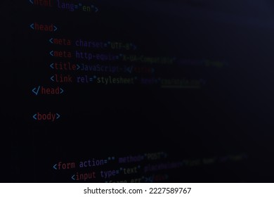 Simple website HTML code with colorful tags in browser view on dark background. Software developer programming code. Screen of code for overlay background.