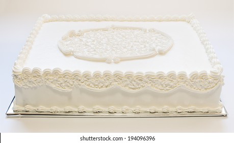 Simple Wedding Cake, All In White On Gray Background. Ornamented On Top. 