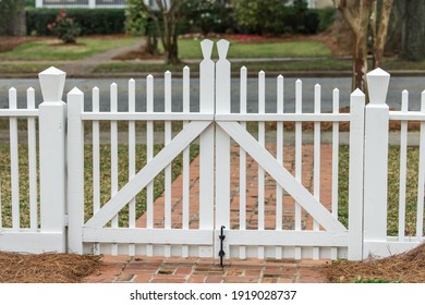 Simple white Americana white fence and closed gate