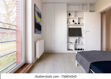 Simple White Bedroom With Bedroom, Bookcase And Wardrobe