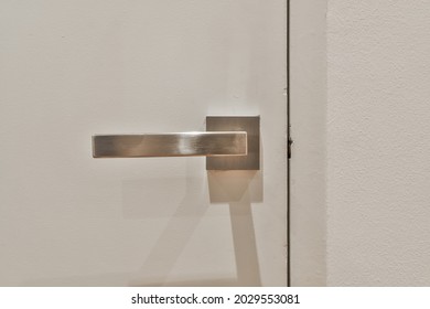 Simple White Door With Metallic Handle. High Quality Photo