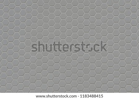 A simple white texture pattern of hexagons as a background