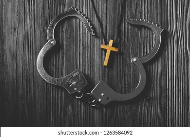 Simple Wood Cross and Unchain Handcuffs. Concept of Jesus Christ the Savior Liberate People from Sin.