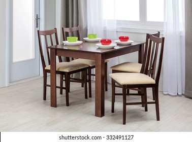 Simple wooden dinning table and chairs in interior - studio ambient room