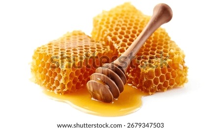 A simple yet powerful studio setup emphasizes the natural texture and golden hues of a fresh, waxy honeycomb
