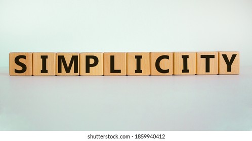 Simplicity concept. Wooden cubes with word 'simplicity'. Beautiful white background. Business and simplicity concept, copy space.