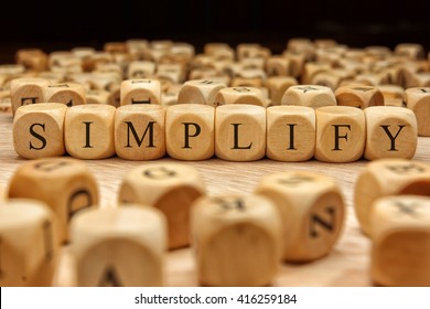 Simplify Word Written On Wood Block
