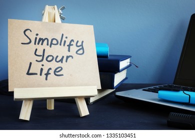 Simplify Your Life Written On A Piece Of Paper.