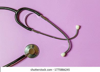 Simply Minimal Design With Medicine Equipment Stethoscope Or Phonendoscope Isolated On Trendy Pastel Purple Violet Background. Instrument Device For Doctor. Health Care Life Insurance Concept