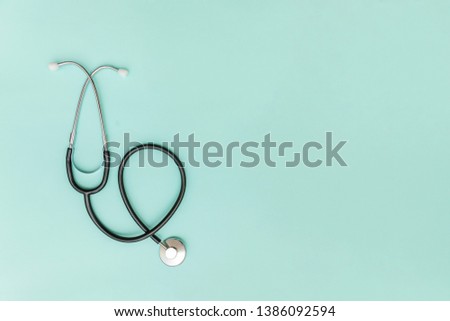 Simply minimal design with medicine equipment stethoscope or phonendoscope isolated on trendy pastel blue background. Instrument device for doctor. Health care life insurance concept