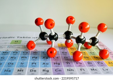 Simulate Shape of covalent molecules on a periodic table background. Soft and selective focus.                              