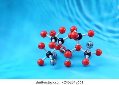 Simulate Shape of covalent molecules on a blue background. Soft and selective focus.