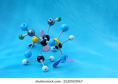 Simulate Shape of covalent molecules on a blue background. Soft and selective focus.
