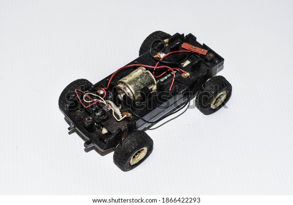 Simulation\
engine of car toy on the white\
background